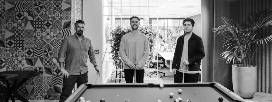 Do Good Things team playing pool.